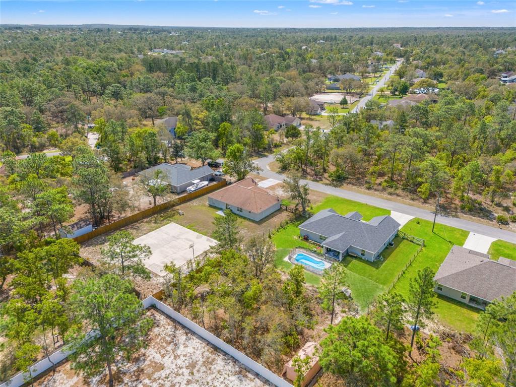 12015 Phoenix Avenue Weeki Wachee, FL 34614 - Photo 3 of 39 an aerial view of residential houses with outdoor space
