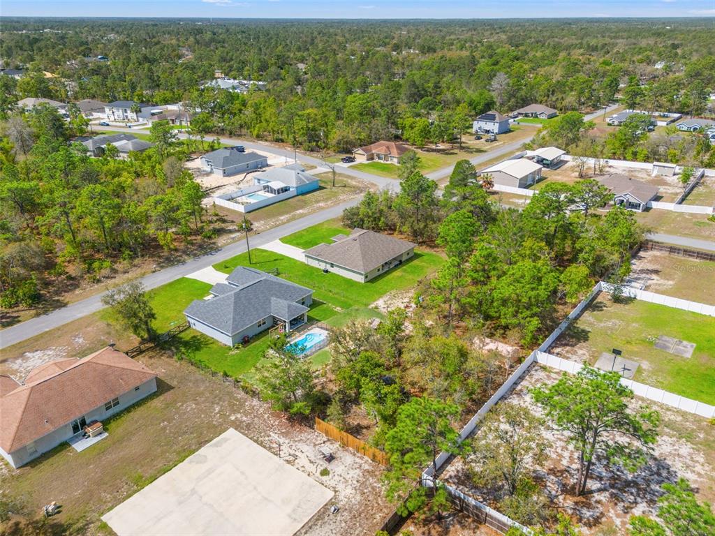 12015 Phoenix Avenue Weeki Wachee, FL 34614 - Photo 35 of 39 an aerial view of residential houses with outdoor space