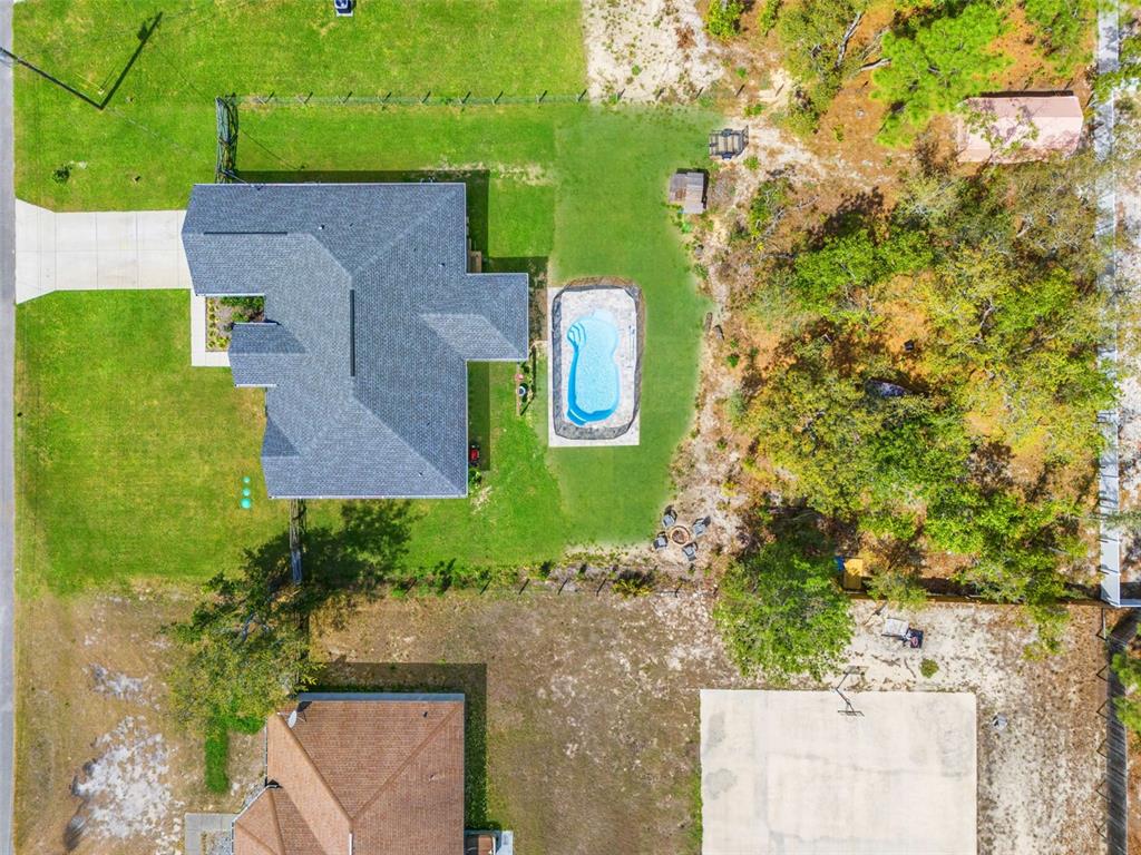 12015 Phoenix Avenue Weeki Wachee, FL 34614 - Photo 36 of 39 an aerial view of a house with a yard