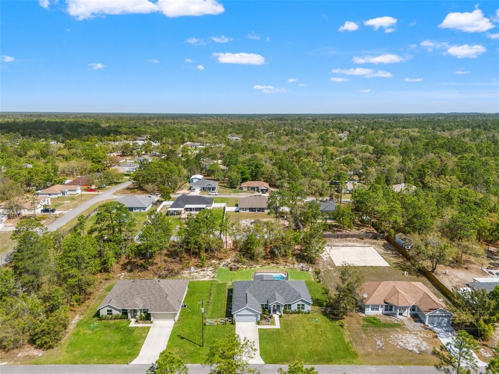 12015 Phoenix Avenue Weeki Wachee, FL 34614 - Photo 37 of 39 an aerial view of residential houses with outdoor space