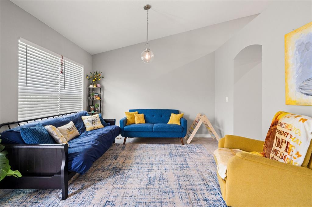 12015 Phoenix Avenue Weeki Wachee, FL 34614 - Photo 6 of 39 a living room with furniture and a couch