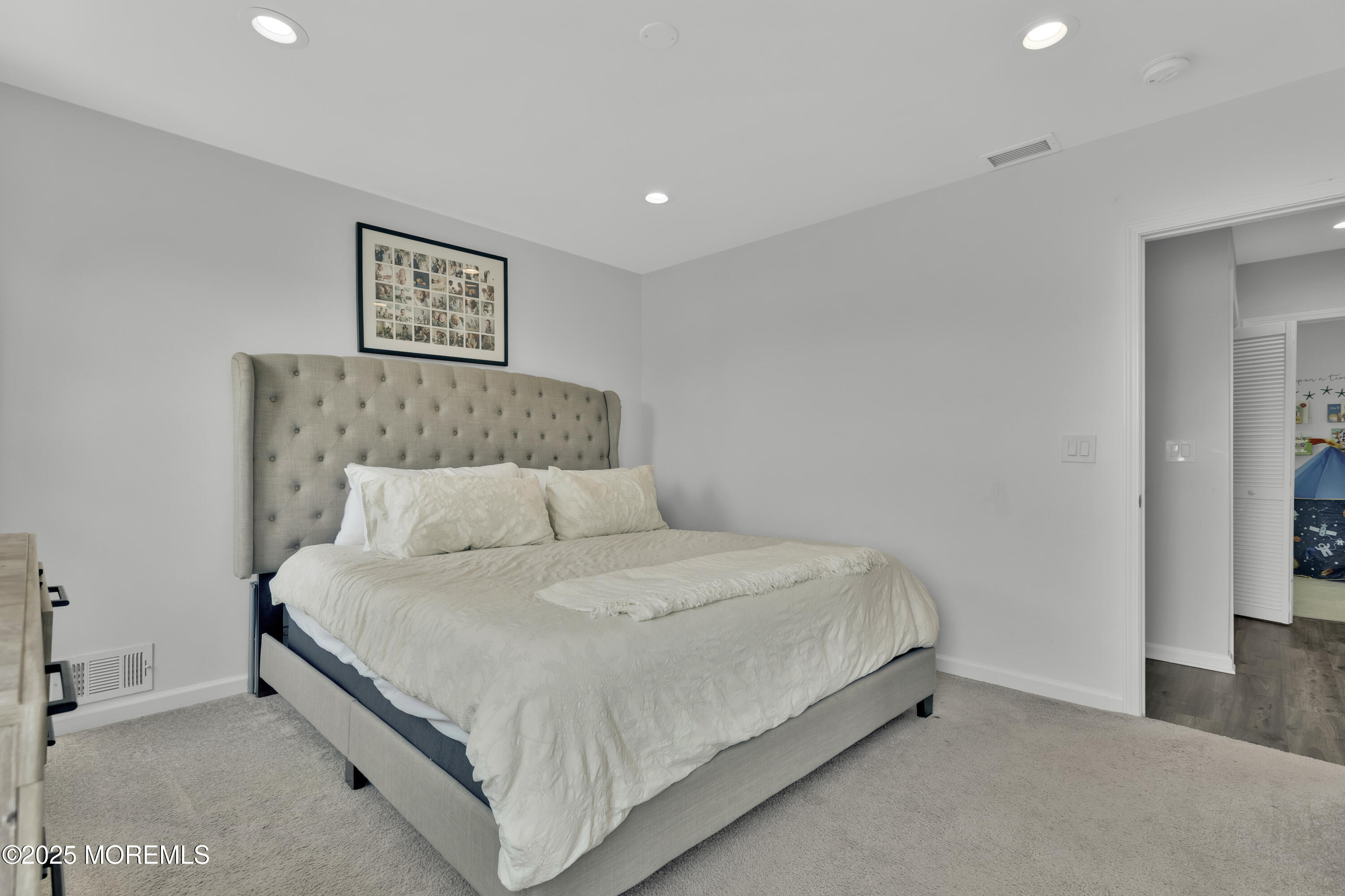 134 County Road Cliffwood, NJ 07721 - Photo 14 of 28 a bedroom with a bed and a walk in closet