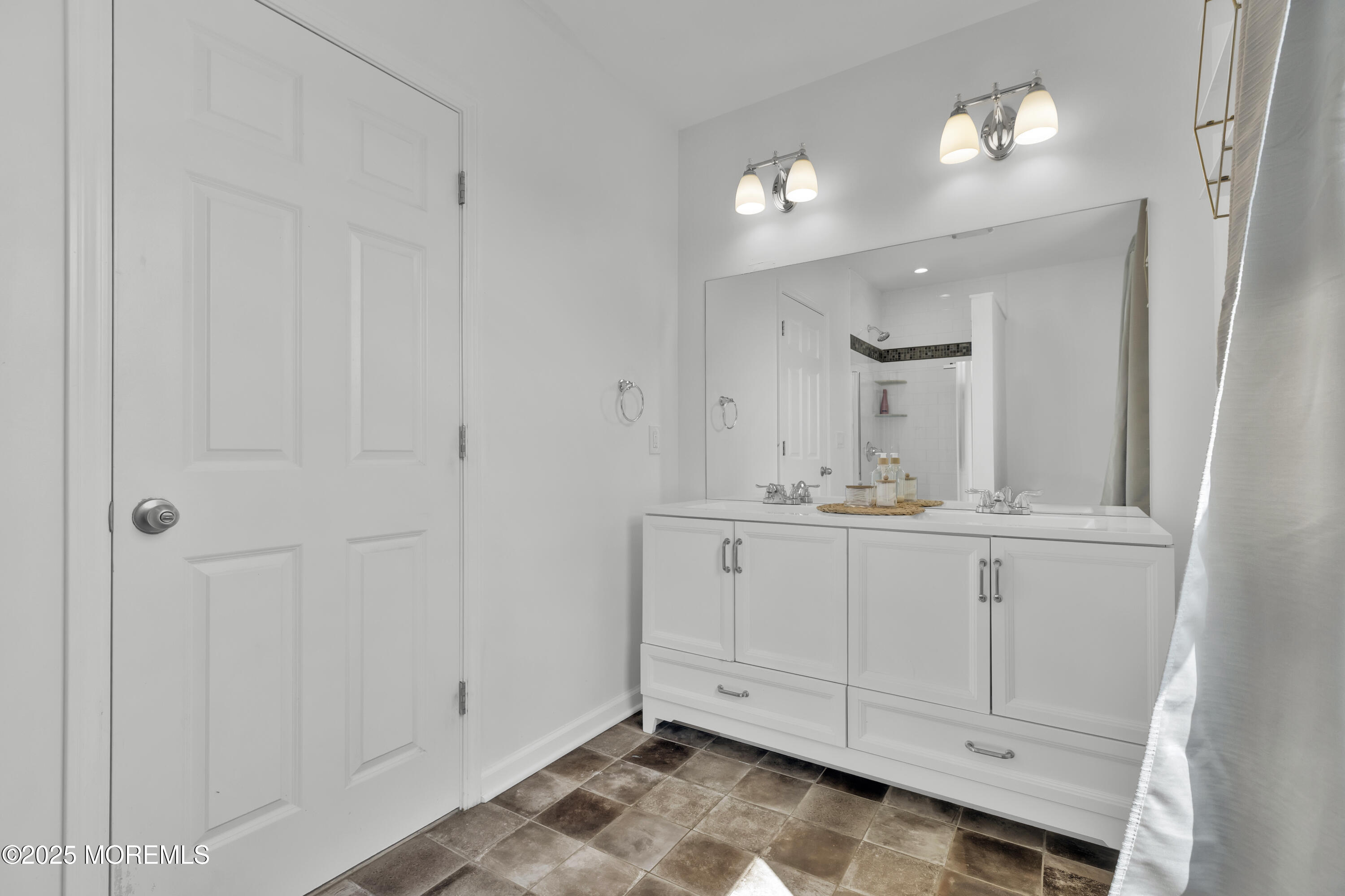 134 County Road Cliffwood, NJ 07721 - Photo 16 of 28 a bathroom with a sink and a mirror