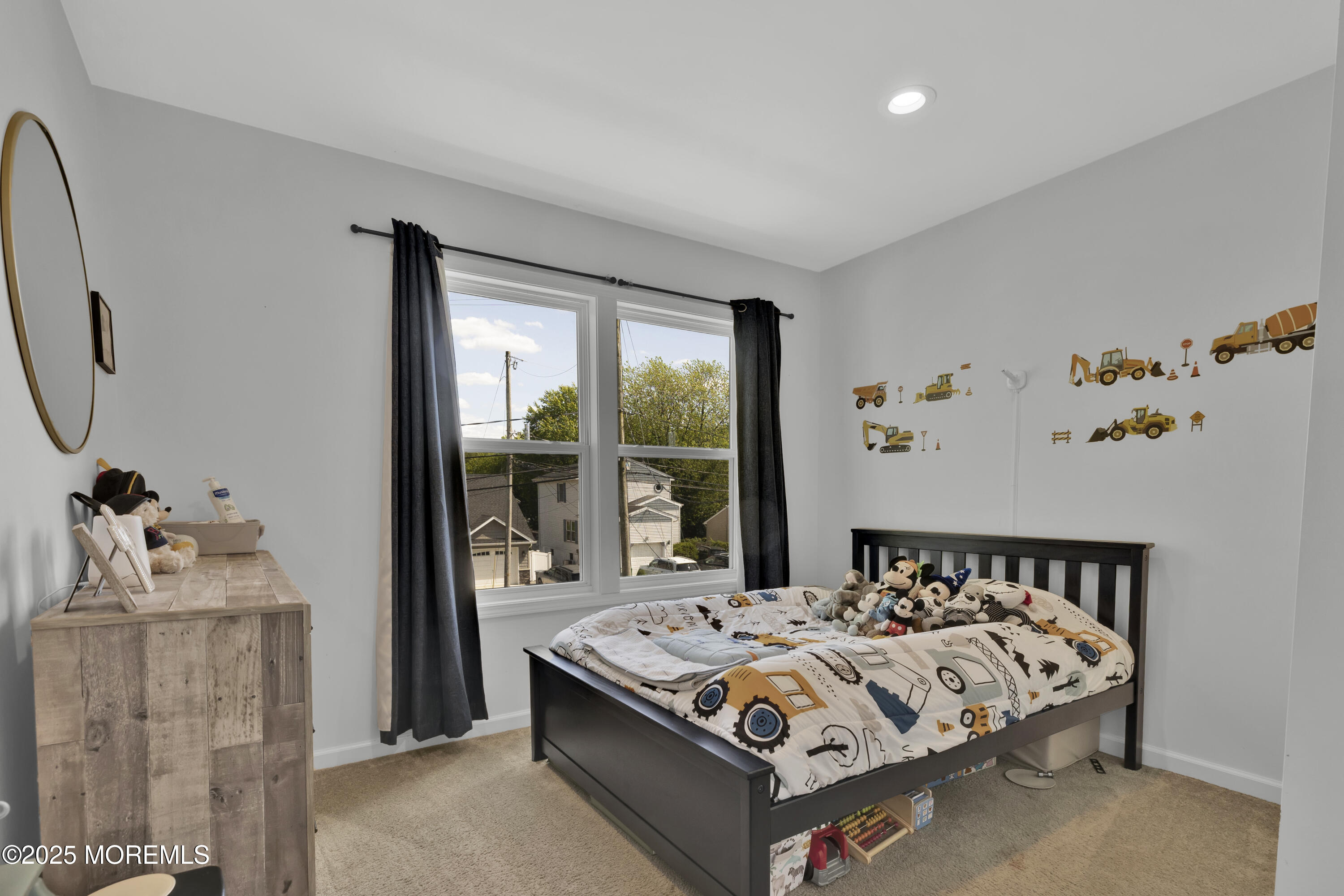 134 County Road Cliffwood, NJ 07721 - Photo 19 of 28 a bed sitting in a bedroom next to a window