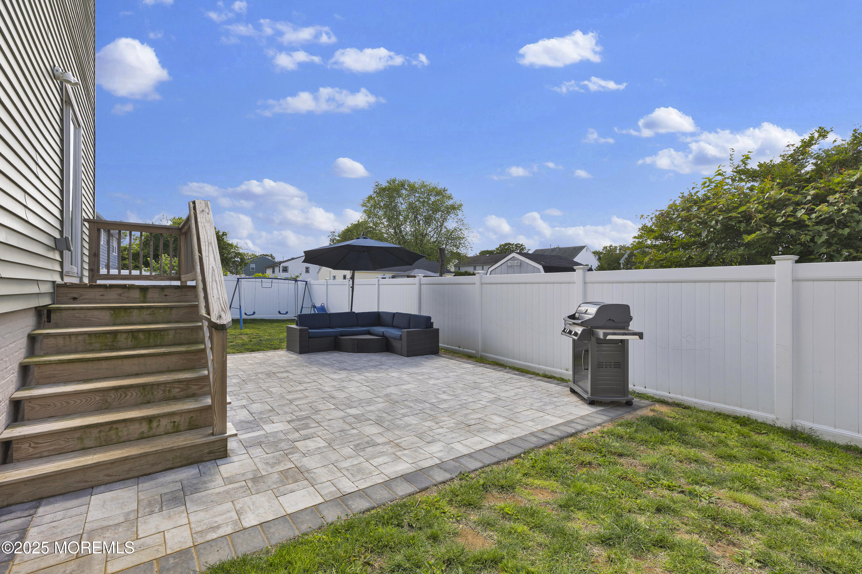 134 County Road Cliffwood, NJ 07721 - Photo 27 of 28 a backyard of a house with table and chairs