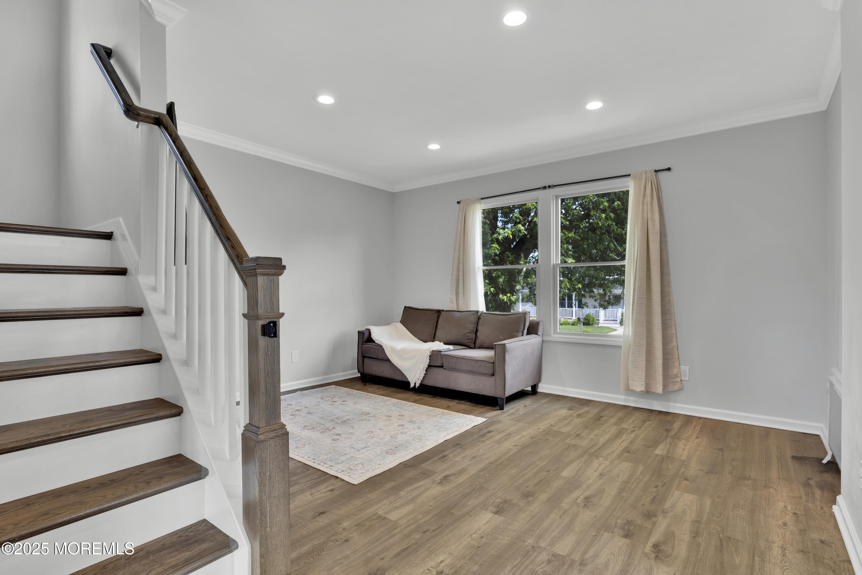 134 County Road Cliffwood, NJ 07721 - Photo 5 of 28 a living room with furniture and stairs