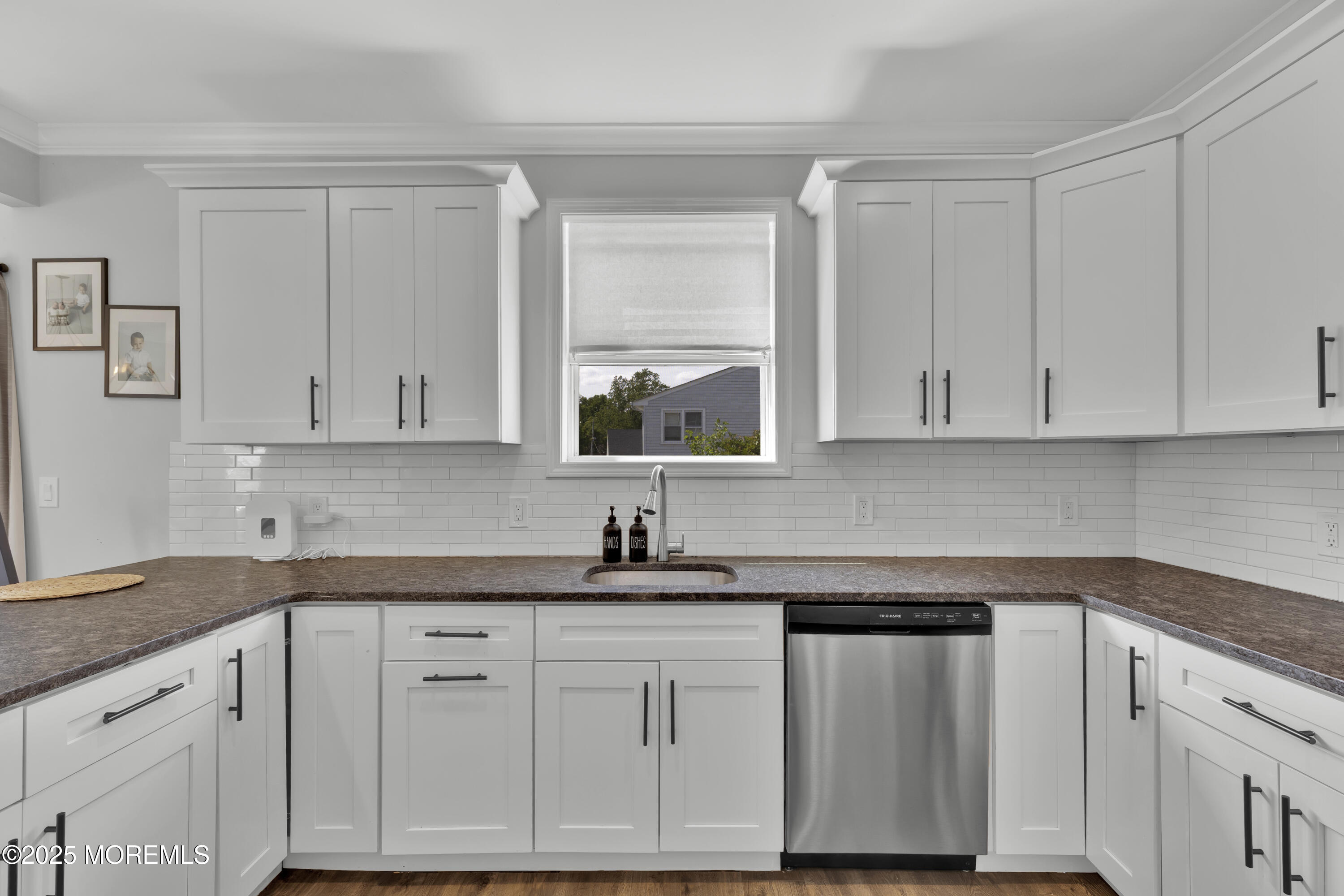 134 County Road Cliffwood, NJ 07721 - Photo 9 of 28 a kitchen with white cabinets and a sink