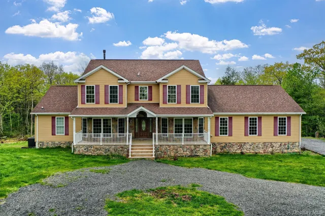 front view of a house with a yard