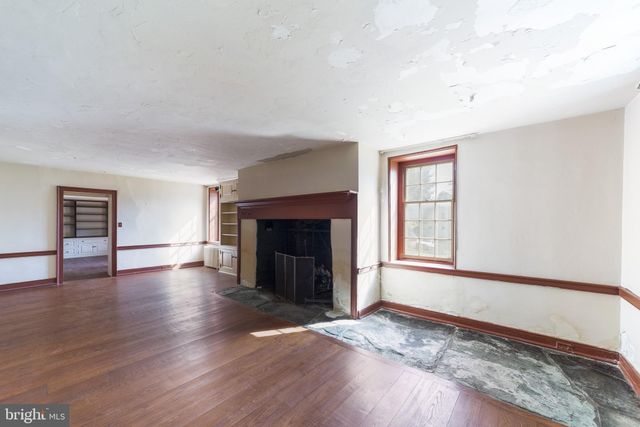 a kitchen with a stove a sink and a refrigerator