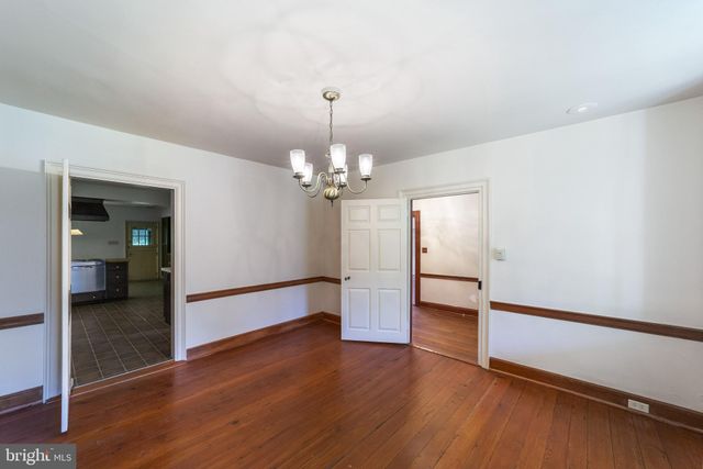 a view of staircase with railing and a window