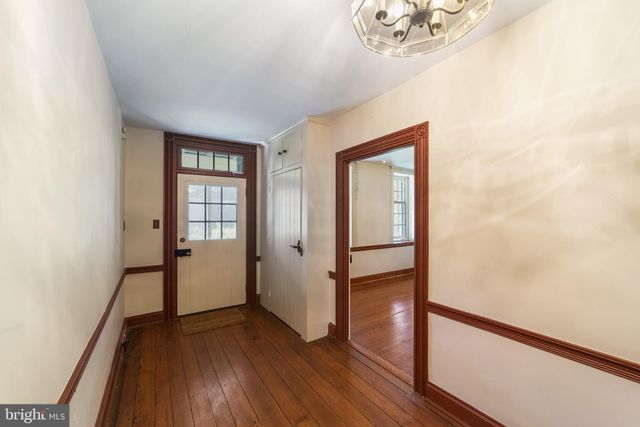 a house that has a big yard with large trees