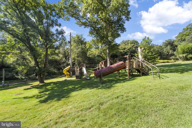 a bathroom with a sink toilet and a mirror