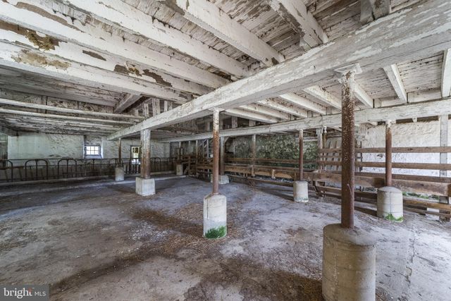 a view of a swimming pool and a yard