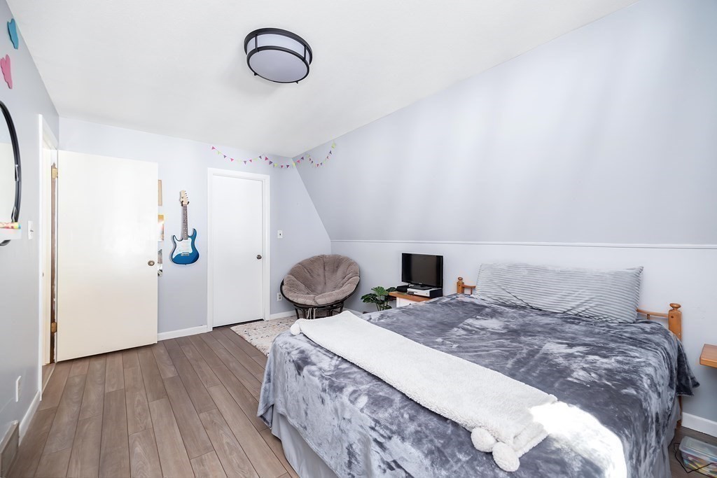 49 Red Bridge Road Wilbraham, MA 01095 - Photo 20 of 40 a bedroom with a bed and wooden floor