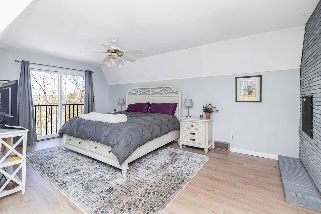 49 Red Bridge Road Wilbraham, MA 01095 - Photo 24 of 40 a bedroom with a large bed and a chandelier