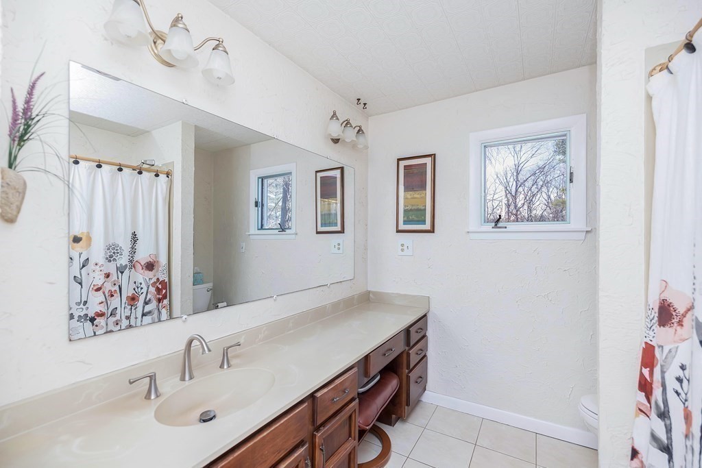 49 Red Bridge Road Wilbraham, MA 01095 - Photo 25 of 40 a bathroom with a sink and a mirror