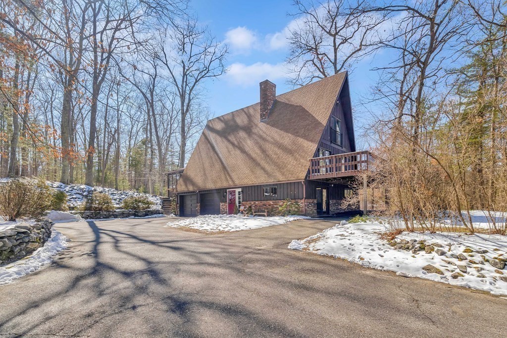 49 Red Bridge Road Wilbraham, MA 01095 - Photo 4 of 40 a view of a house with snow on the road