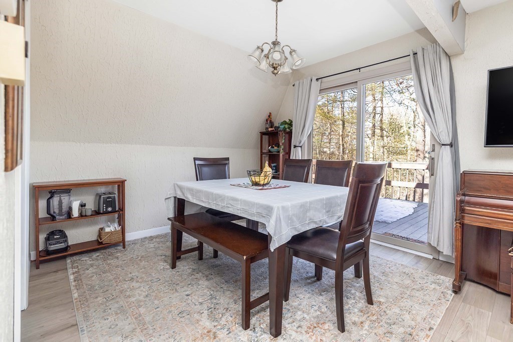 49 Red Bridge Road Wilbraham, MA 01095 - Photo 9 of 40 a view of a dining room with furniture window and wooden floor