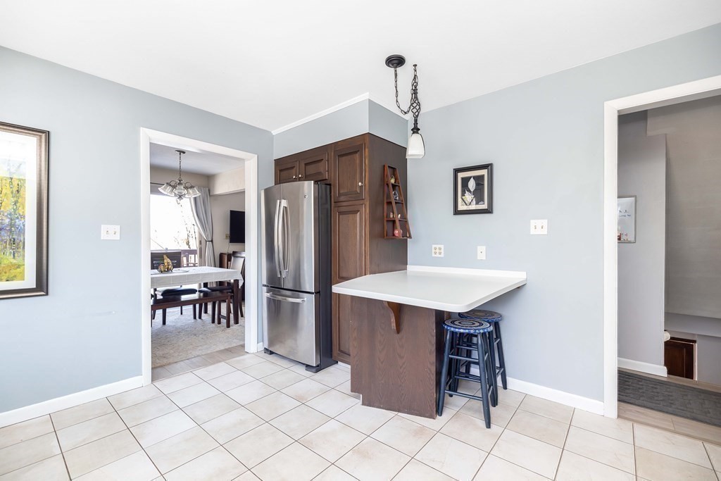49 Red Bridge Road Wilbraham, MA 01095 - Photo 10 of 40 a kitchen with stainless steel appliances a sink cabinets and wooden floor