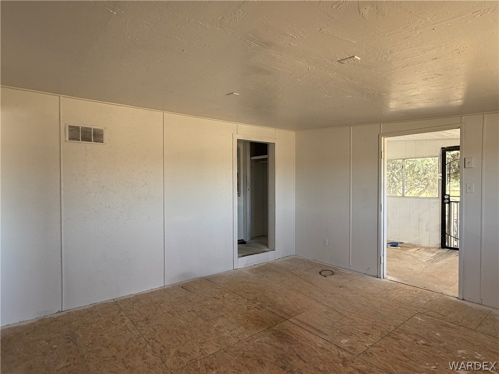 8051 7th Street Dolan Springs, AZ 86441 - Photo 16 of 65 a view of a big room with windows and closet