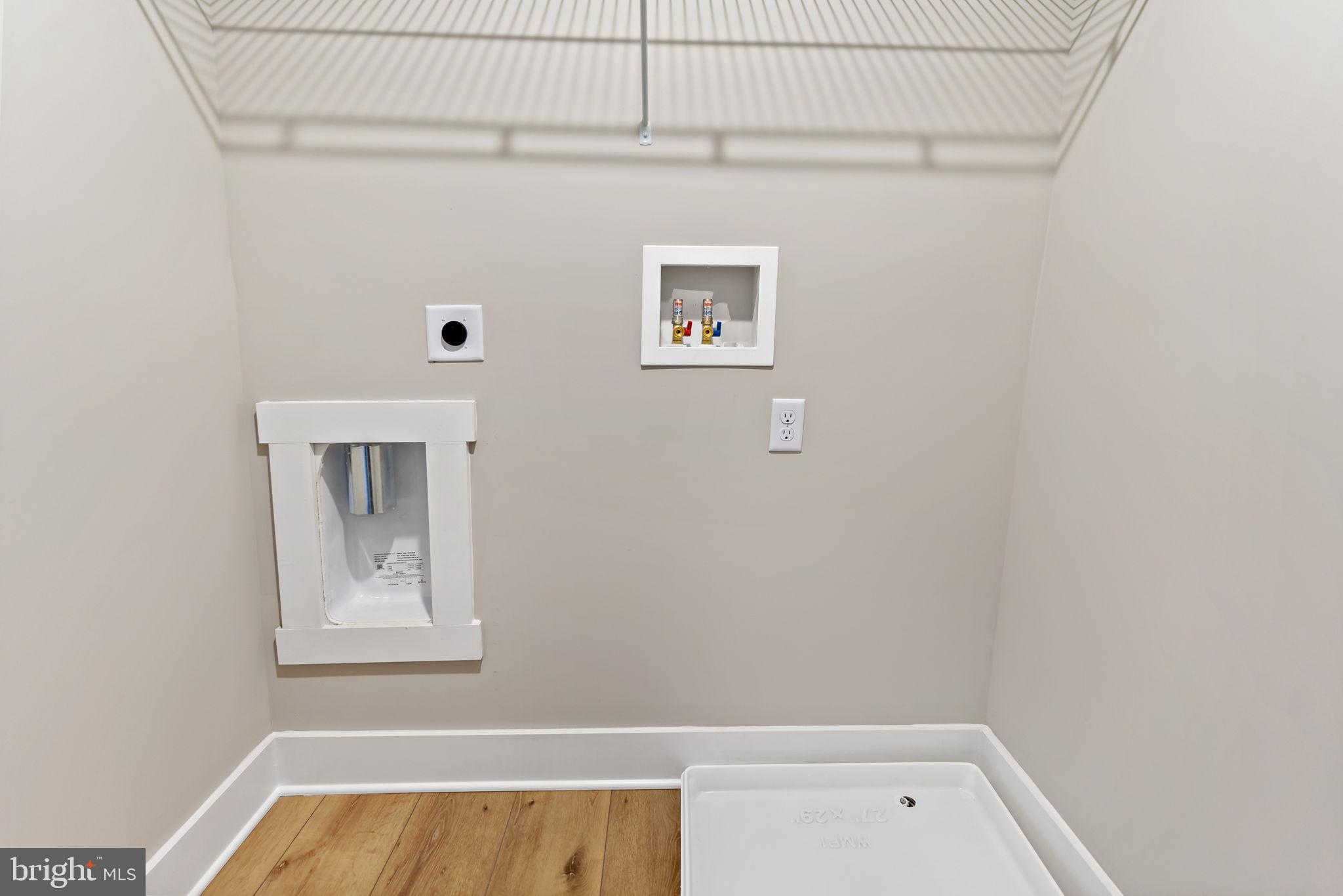 412 East 7th Avenue Ranson, WV 25438 - Photo 33 of 36 Modern laundry nook with sleek design.
