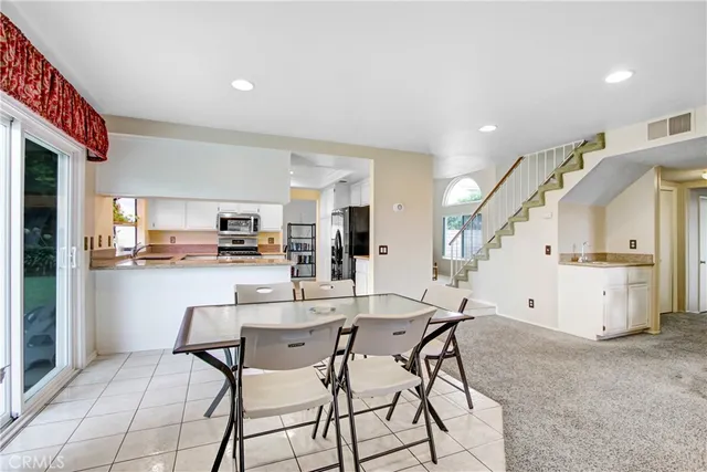 a view of kitchen with furniture and wooden floor