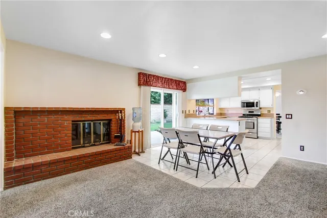 a dining room with furniture and a fireplace