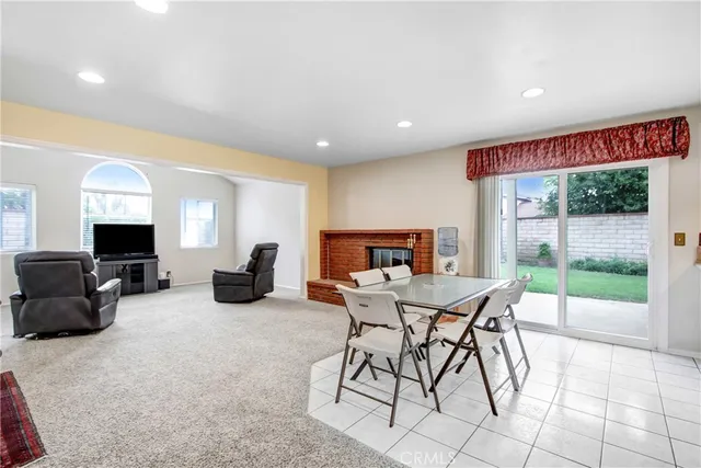 a view of a livingroom with furniture and a flat screen tv