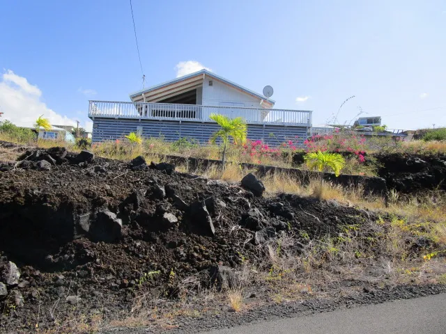 a view of an ocean beach and mountain