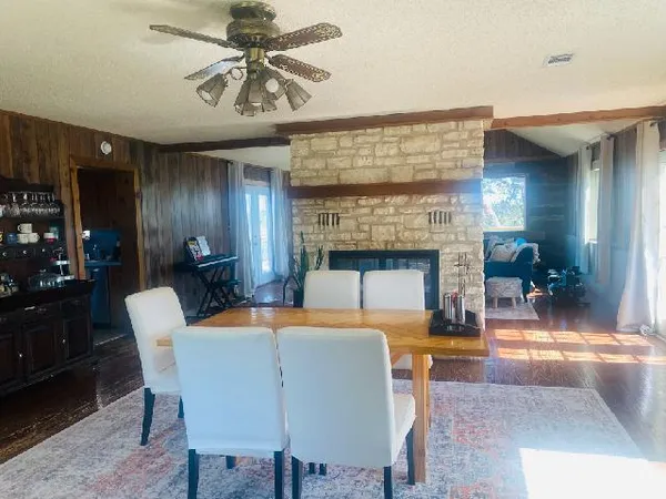 a dining room with furniture and a fireplace