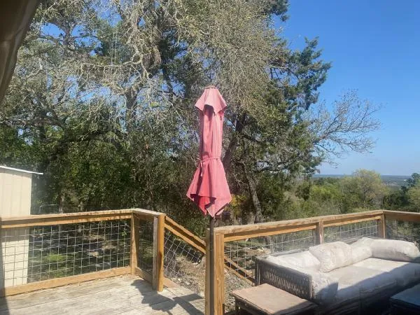 a balcony view with a seating space