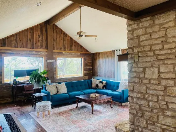 a living room with furniture and a large window