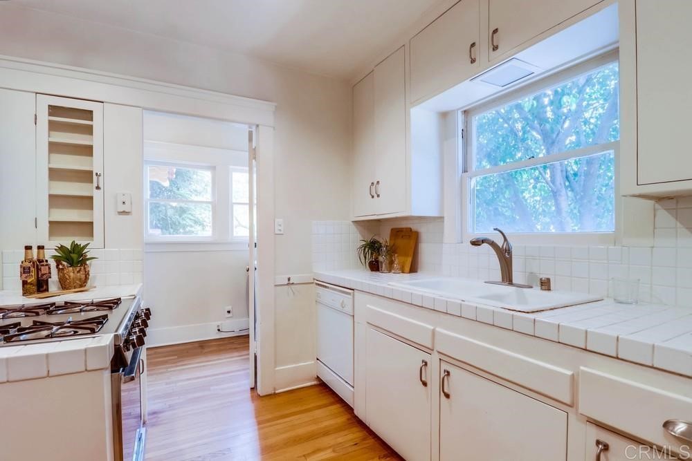 1944 Granada Avenue San Diego, CA 92102 - Photo 26 of 65 a kitchen with a stove a sink and a window