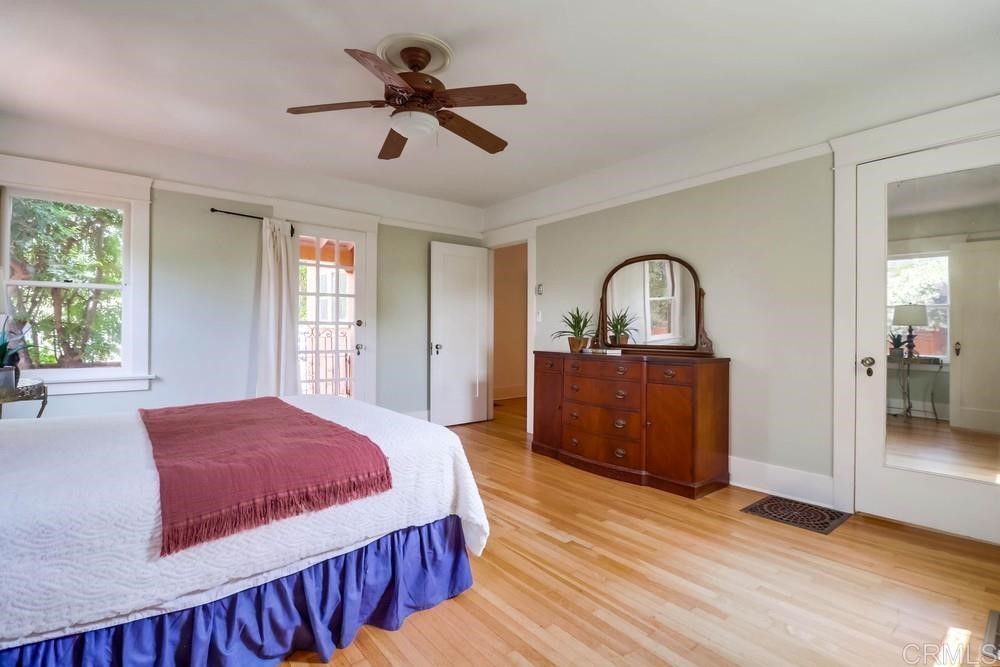 1944 Granada Avenue San Diego, CA 92102 - Photo 38 of 65 a bedroom with a bed and a dresser next to a window