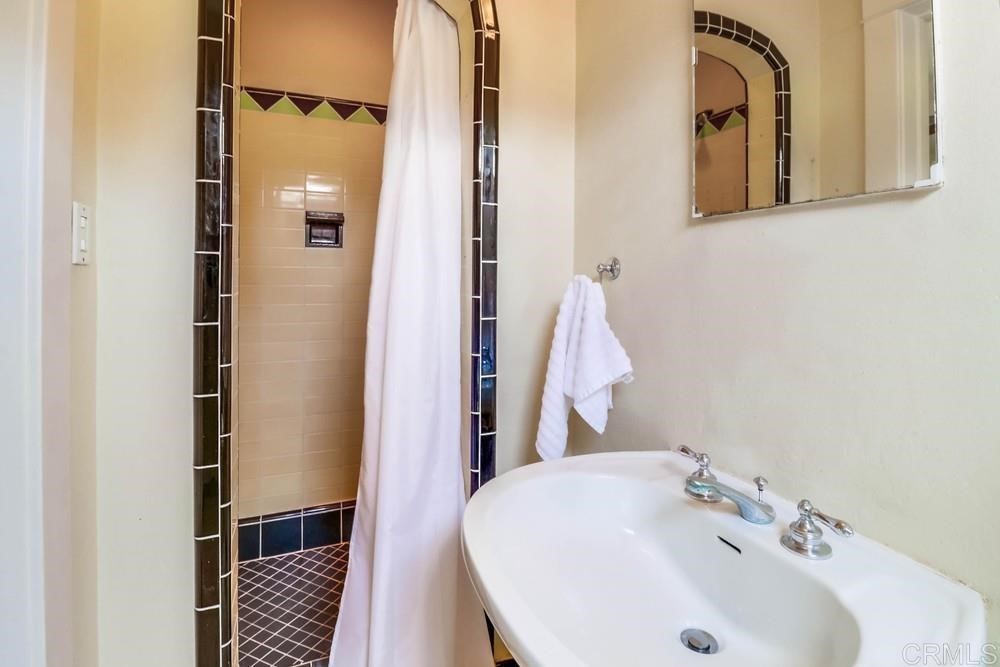 1944 Granada Avenue San Diego, CA 92102 - Photo 39 of 65 a bathroom with a sink and a mirror