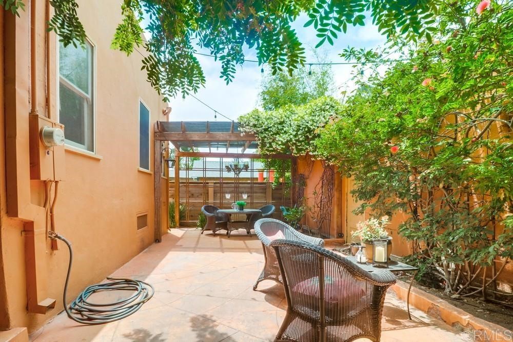 1944 Granada Avenue San Diego, CA 92102 - Photo 46 of 65 a backyard of a house with table and chairs
