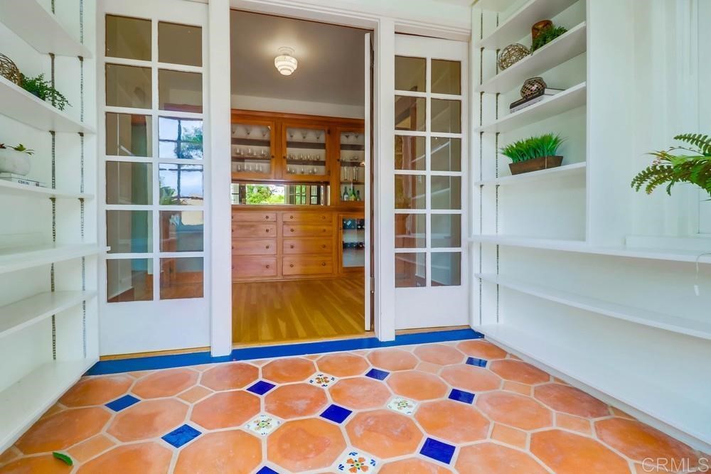 1944 Granada Avenue San Diego, CA 92102 - Photo 54 of 65 a view of an empty room with wooden floor and windows