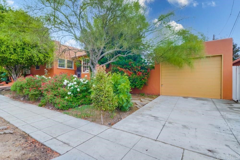 1944 Granada Avenue San Diego, CA 92102 - Photo 65 of 65 a view of backyard with potted plants and a large tree