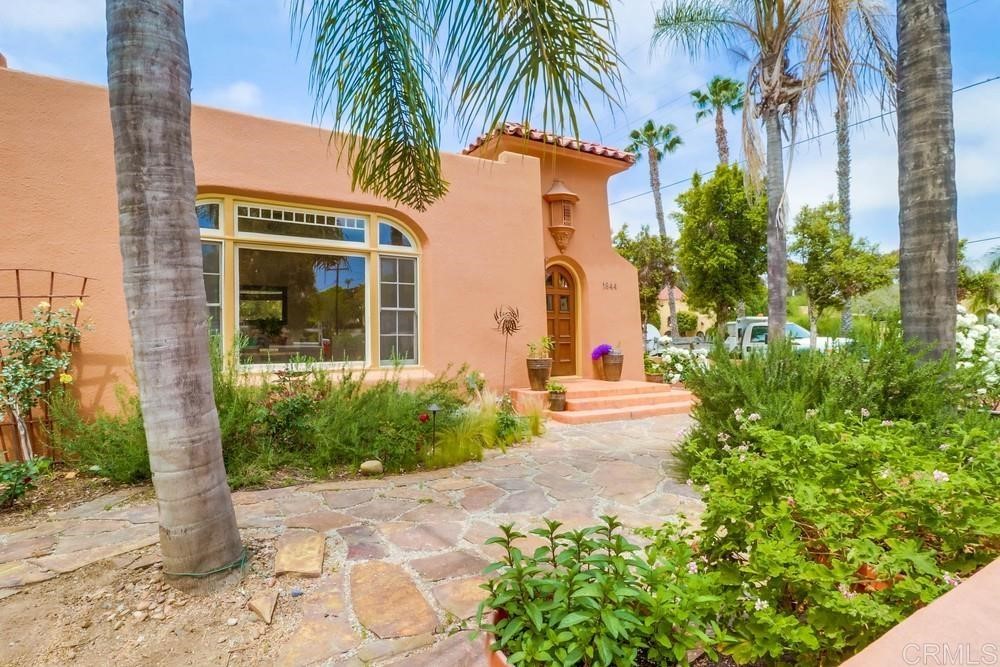 1944 Granada Avenue San Diego, CA 92102 - Photo 10 of 65 a front view of a house with garden and glass windows