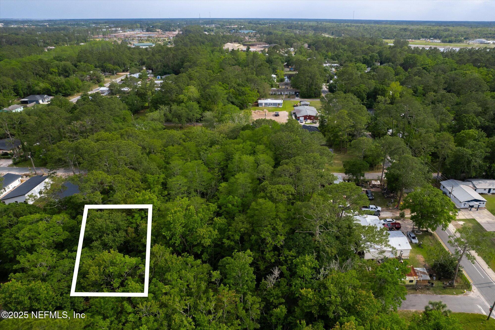 0 West 8th Street St. Augustine, FL 32084 - Photo 5 of 26 an aerial view of residential houses with outdoor space and trees