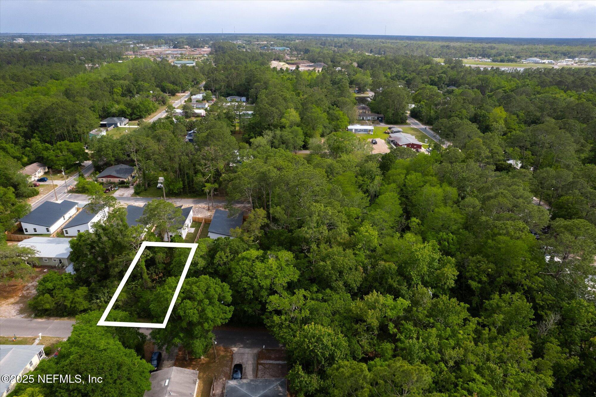 0 West 8th Street St. Augustine, FL 32084 - Photo 8 of 26 an aerial view of residential houses with outdoor space and trees