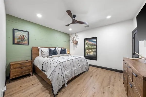 a bathroom with a sink mirror vanity and toilet