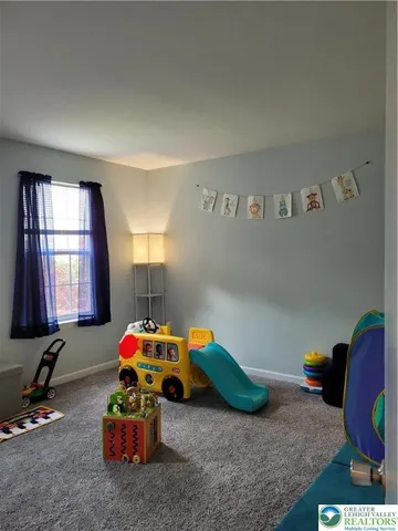 a kids room with toys and dresser