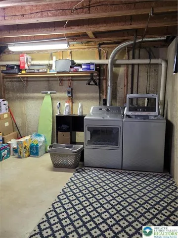 a kitchen with a refrigerator and a stove