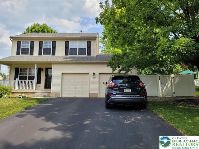a view of a car parked in front of a house