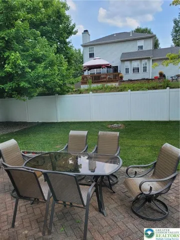a view of a chairs and table in the terrace