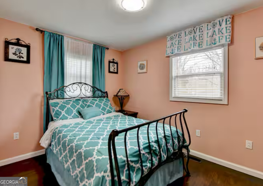 2817 Evergreen Place Gainesville, GA 30501 - Photo 11 of 27 a bedroom with a bed and wooden floor