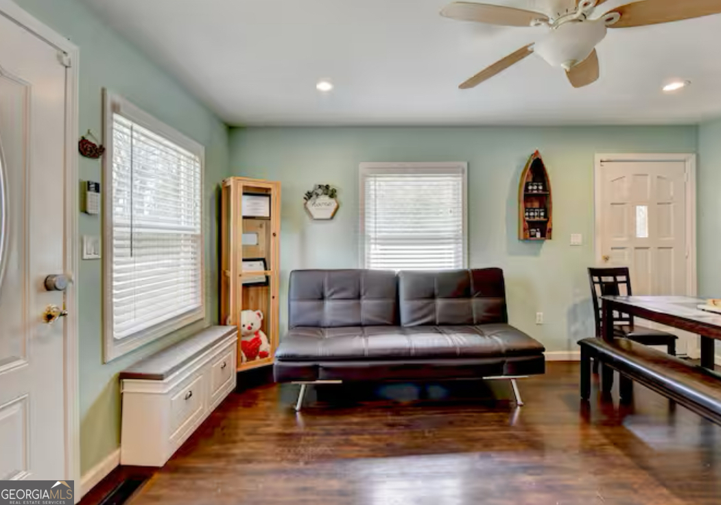 2817 Evergreen Place Gainesville, GA 30501 - Photo 14 of 27 a living room with furniture and a wooden floor