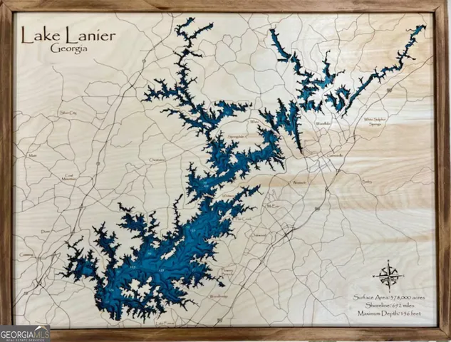 a backyard of a house with fire pit and outdoor seating