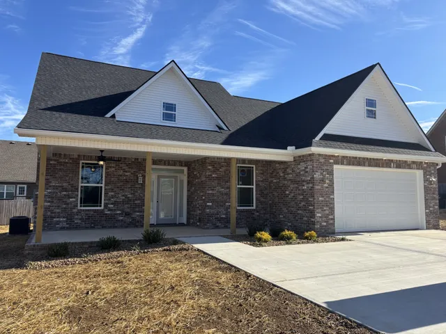 a front view of a house with yard